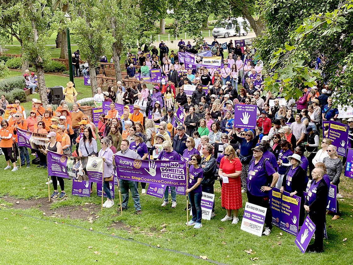 Around 1,000 people gather in the Pioneer Women's Memorial Garden to hear inspiring speakers.